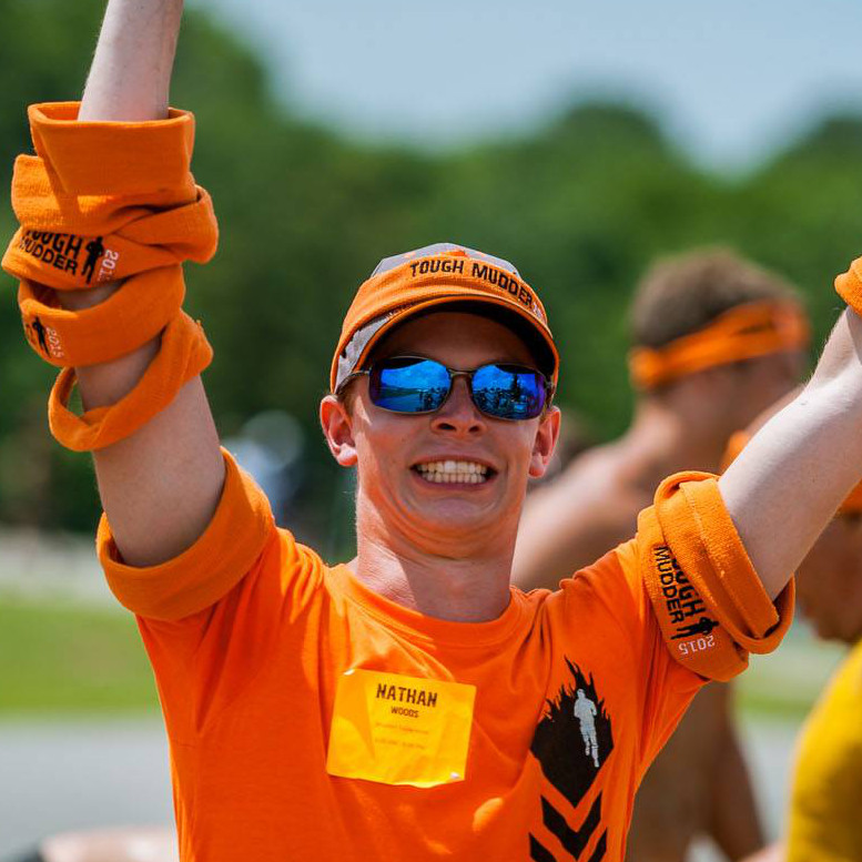 Volunteer at the finish with Tough Mudder Headbands